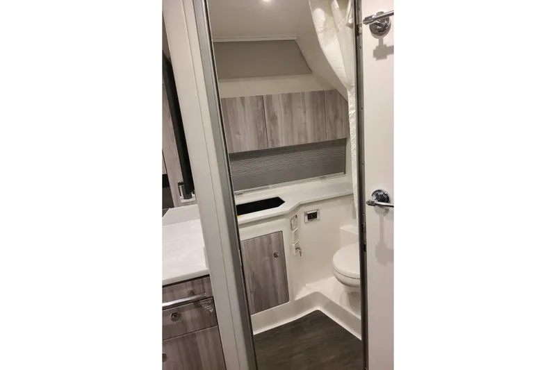 Slide: The Image of Interior of 2026 Formula 400 Super Sport Crossover boat bathroom, featuring modern design. - 27