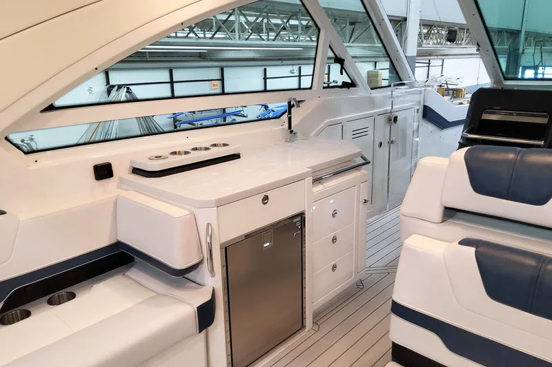 Slide: The Image of Interior of 2026 Formula 400 Super Sport Crossover yacht, featuring sleek kitchen and seating area. - 3