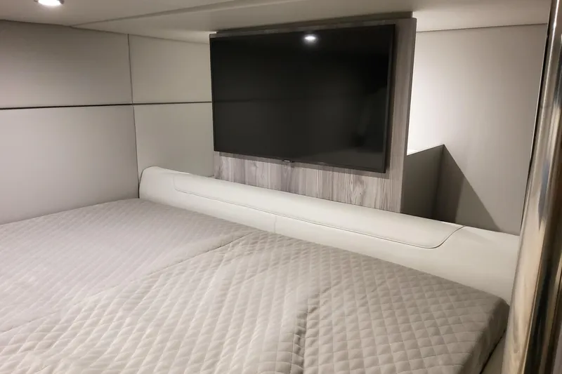 Slide: The Image of Interior cabin of 2026 Formula 400 Super Sport Crossover with bed and wall-mounted TV. - 30