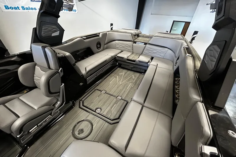 Slide: The Image of Luxurious interior of 2025 Supra SE boat with sleek gray seating and modern design. - 7