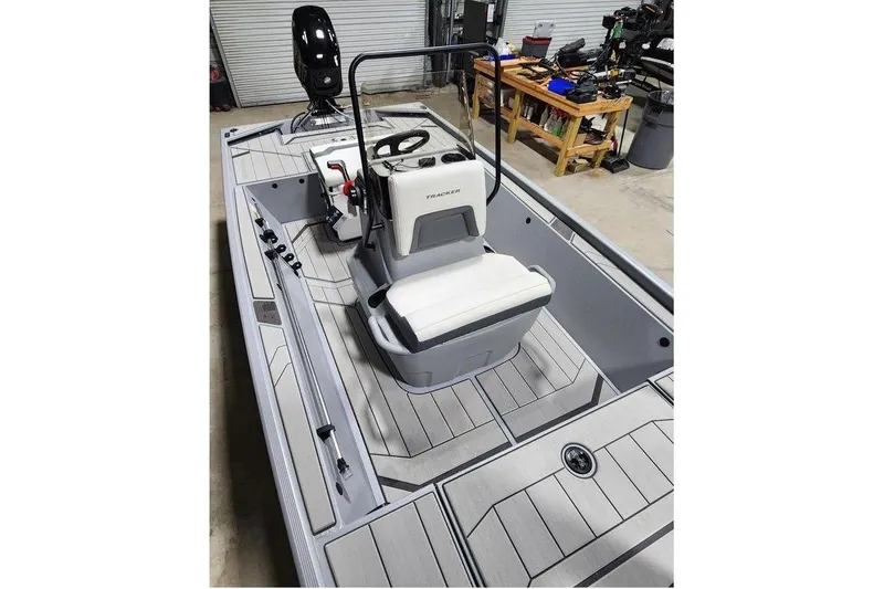 Slide: The Image of 2026 Tracker Bass Tracker Classic CC boat interior with seating and steering console. - 10