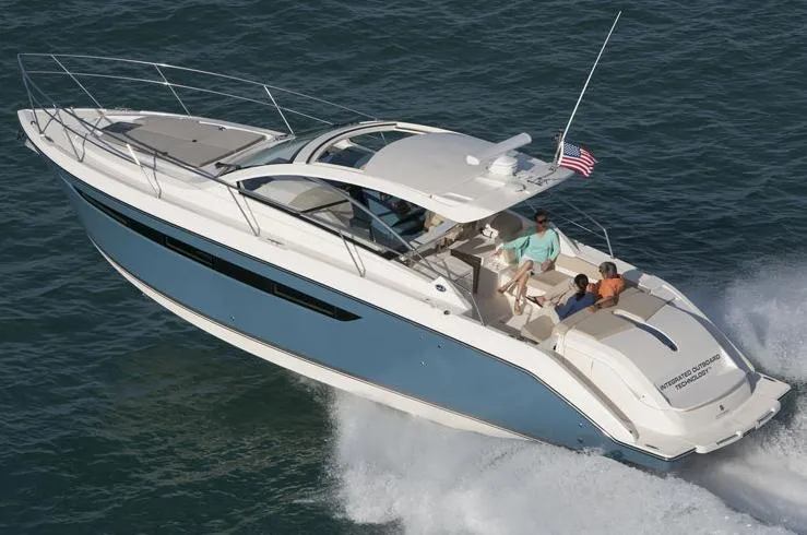 Slide: The Image of 2013 Pursuit SC 365i Sport Coupe docked at marina, front view. - 1