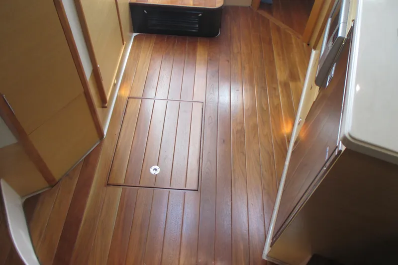 Slide: The Image of 2013 Pursuit SC 365i Sport Coupe interior with polished wooden flooring. - 23