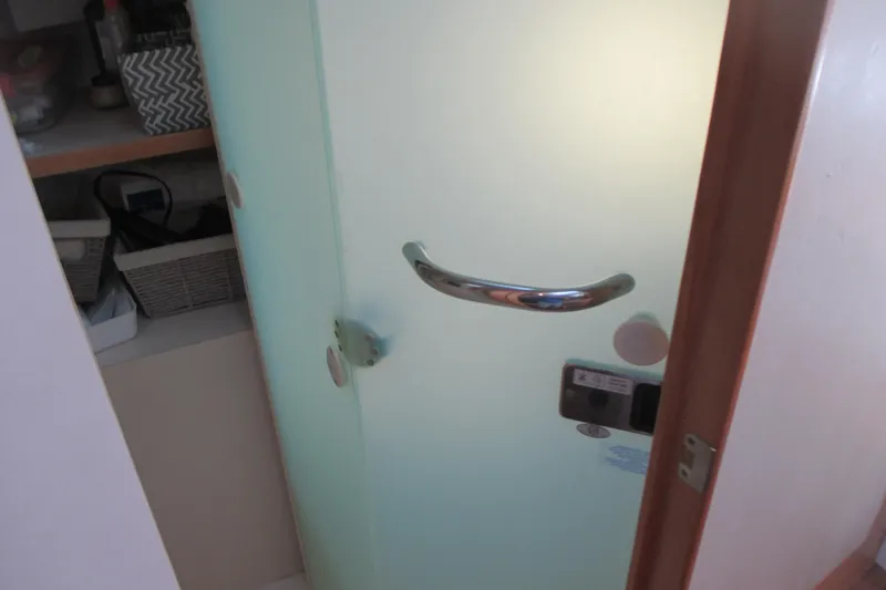 Slide: The Image of Frosted glass door with chrome handle inside 2013 Pursuit SC 365i Sport Coupe. - 30