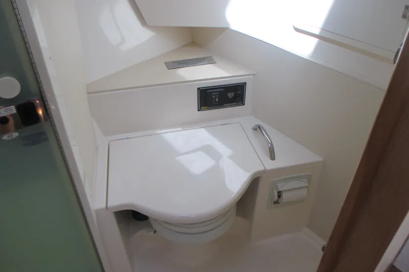 Slide: The Image of 2013 Pursuit SC 365i Sport Coupe bathroom with compact toilet and modern design. - 31