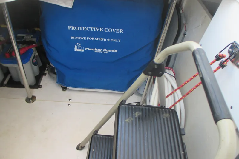 Slide: The Image of 2013 Pursuit SC 365i Sport Coupe engine room with protective cover and ladder. - 37