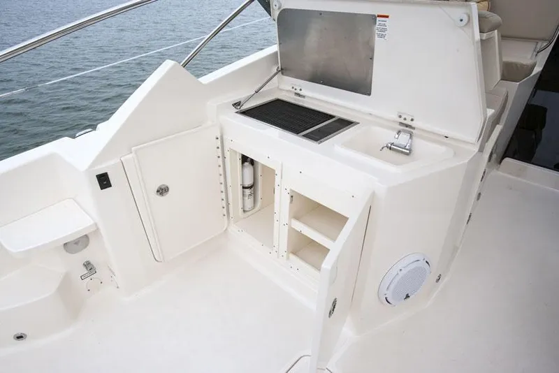 Slide: The Image of Manufacturer Provided Image: Twin Yamaha 350 engines on a 2013 Pursuit SC 365i Sport Coupe boat. - 7