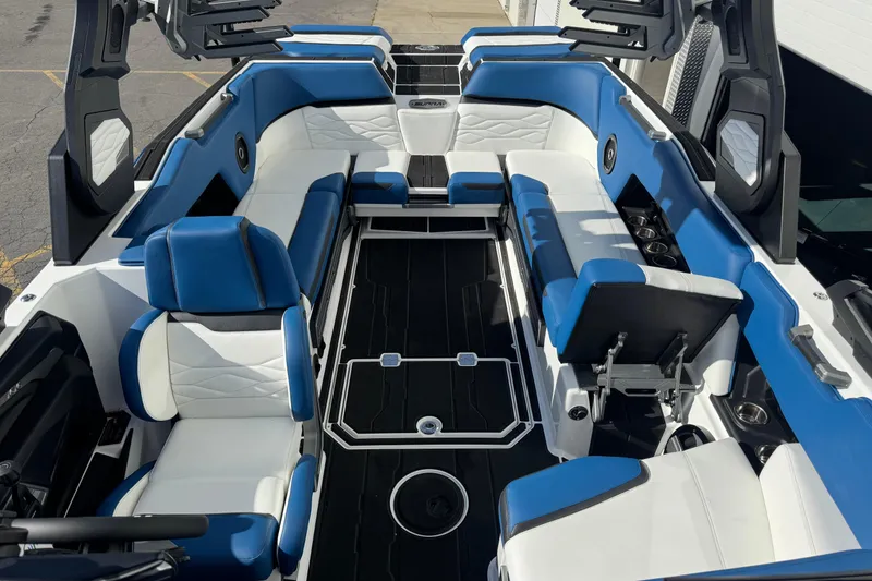 Slide: The Image of 2026 Supra SE 575 boat interior with blue and white seating, modern design. - 3