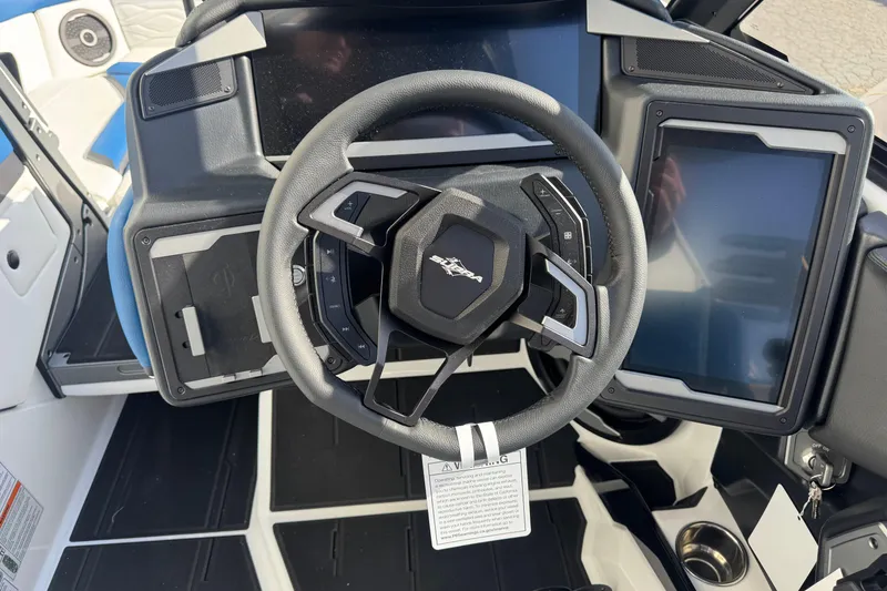 Slide: The Image of Steering wheel and dashboard of 2026 Supra SE 575 boat with modern controls. - 6