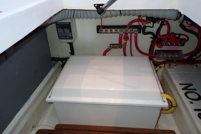 Slide: The Image of Electrical compartment of 2023 True North 34 Outboard Express with wiring and components. - 107