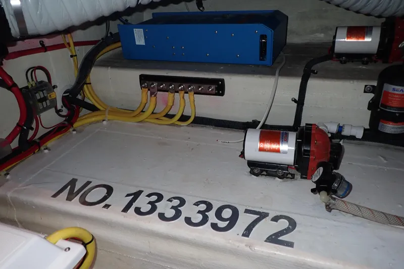 Slide: The Image of Engine compartment of 2023 True North 34 Outboard Express with wiring and equipment. - 108