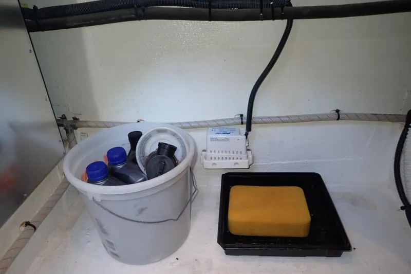 Slide: The Image of Storage area in 2023 True North 34 Outboard Express with cleaning supplies and equipment. - 111