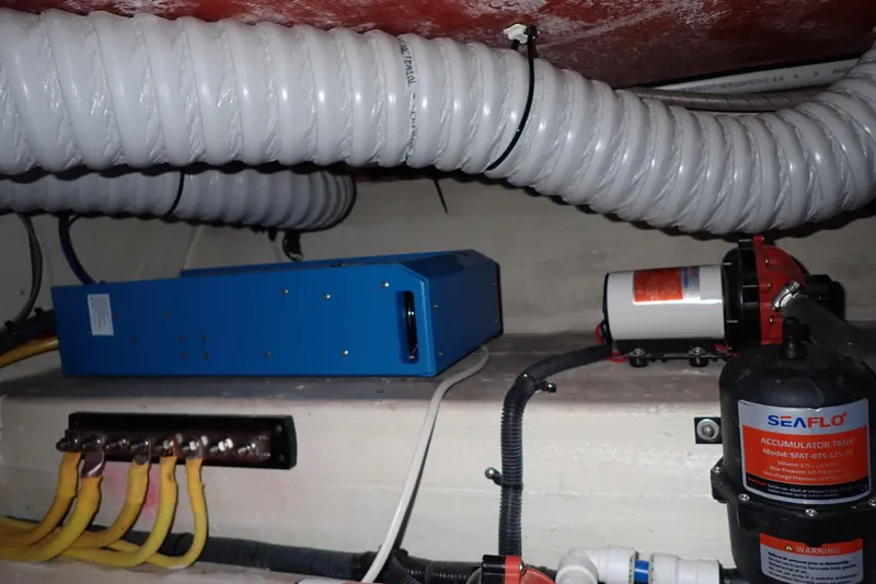 Slide: The Image of Engine compartment of 2023 True North 34 Outboard Express with Seaflo components and wiring. - 113