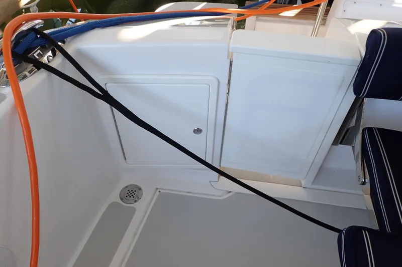 Slide: The Image of 2023 True North 34 Outboard Express boat interior with seating and storage compartments. - 114