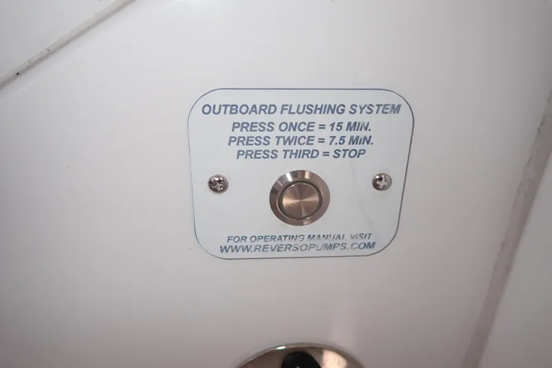 Slide: The Image of Outboard flushing system button on 2023 True North 34 Outboard Express boat. - 125