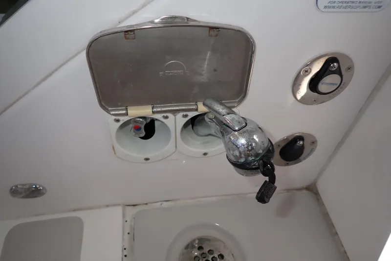 Slide: The Image of 2023 True North 34 Outboard Express boat shower controls and faucet detail. - 127