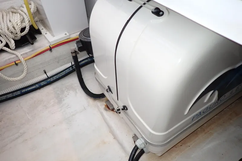 Slide: The Image of Engine compartment of 2023 True North 34 Outboard Express with visible wiring and hoses. - 131