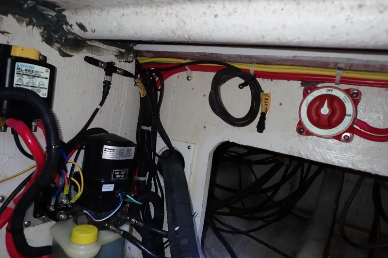 Slide: The Image of Electrical wiring and components inside a 2023 True North 34 Outboard Express boat. - 135