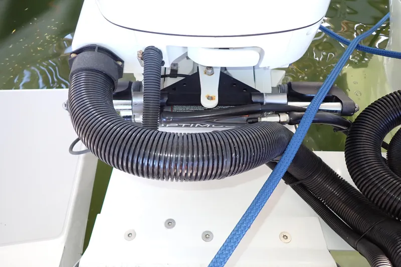 Slide: The Image of Close-up of 2023 True North 34 Outboard Express engine components and hoses. - 138