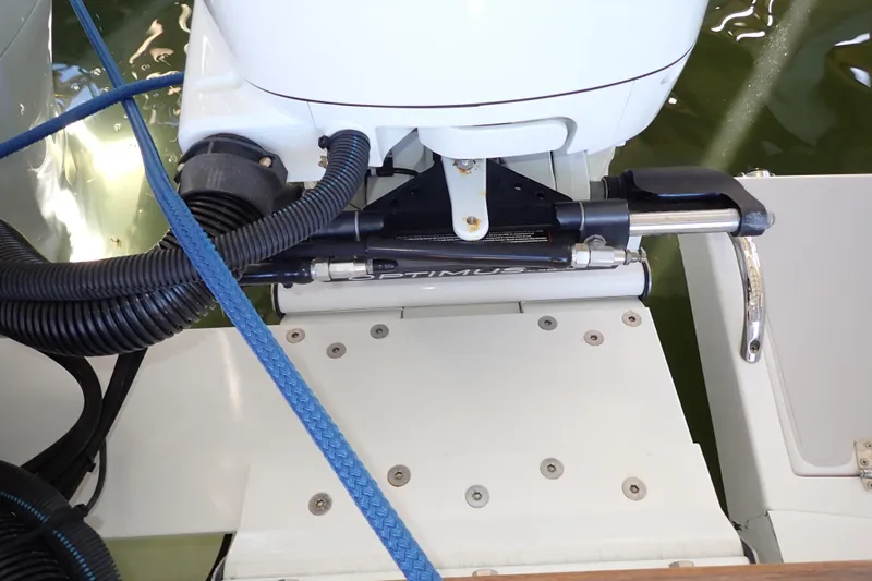 Slide: The Image of 2023 True North 34 Outboard Express engine detail with blue rope and hydraulic components. - 139