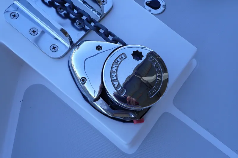 Slide: The Image of Chrome anchor windlass on 2023 True North 34 Outboard Express boat deck. - 142