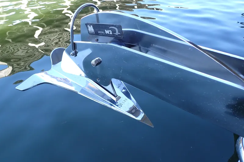 Slide: The Image of Anchor of 2023 True North 34 Outboard Express on calm water. - 143