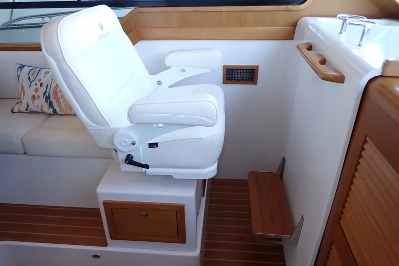 Slide: The Image of Luxury seating on 2023 True North 34 Outboard Express boat, featuring elegant design and comfort. - 16
