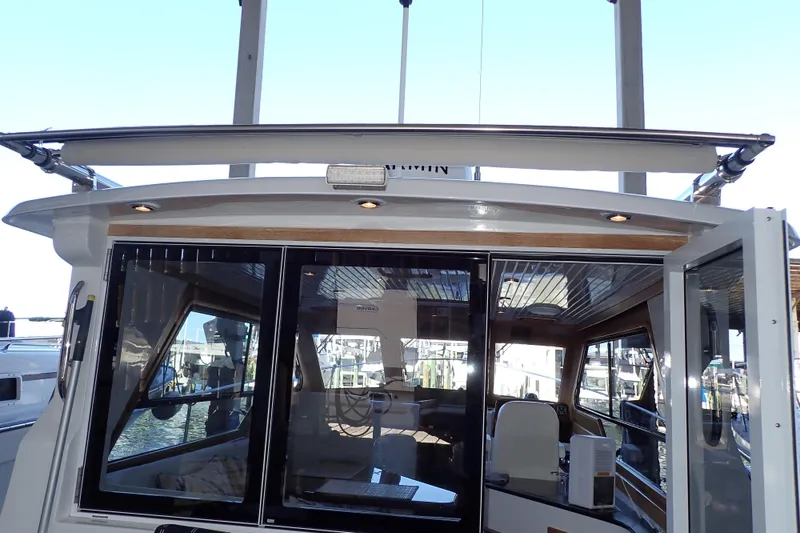 Slide: The Image of 2023 True North 34 Outboard Express boat with sleek cabin and modern design. - 38