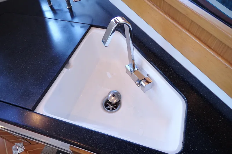 Slide: The Image of Modern sink and faucet in 2023 True North 34 Outboard Express yacht kitchen. - 45