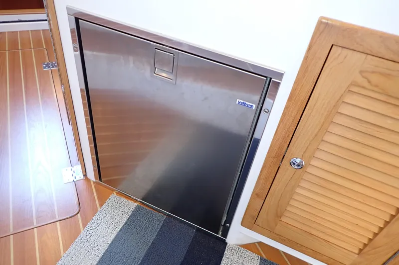 Slide: The Image of Stainless steel door on 2023 True North 34 Outboard Express boat interior. - 46