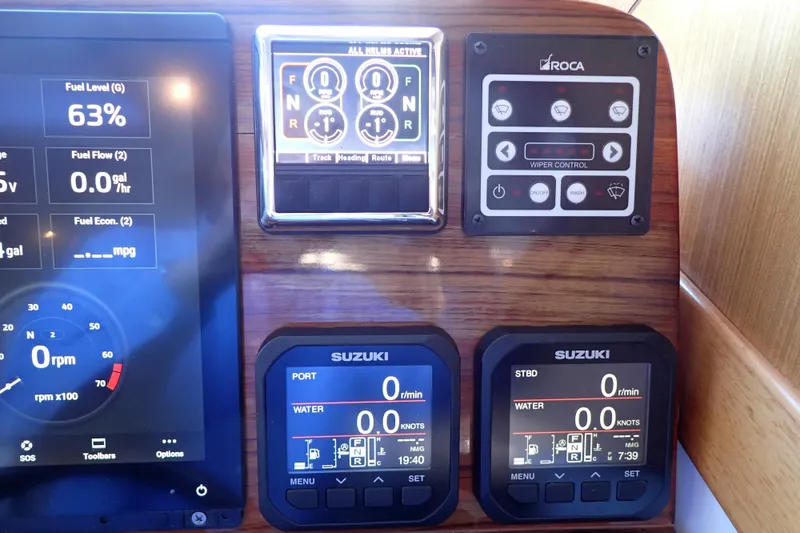 Slide: The Image of Dashboard of 2023 True North 34 Outboard Express with digital displays and controls. - 51