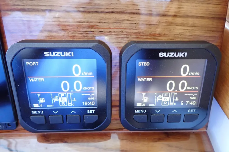 Slide: The Image of Digital displays on a 2023 True North 34 Outboard Express boat dashboard. - 53