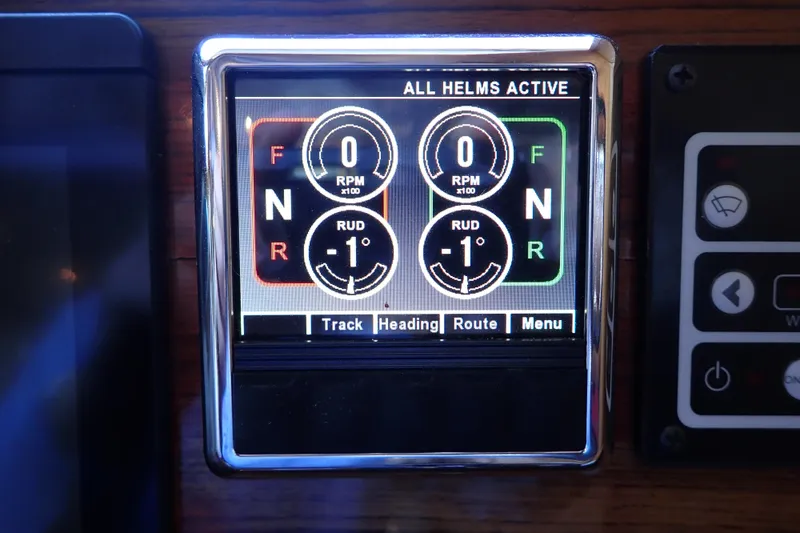 Slide: The Image of Display panel of 2023 True North 34 Outboard Express showing helm controls and settings. - 54
