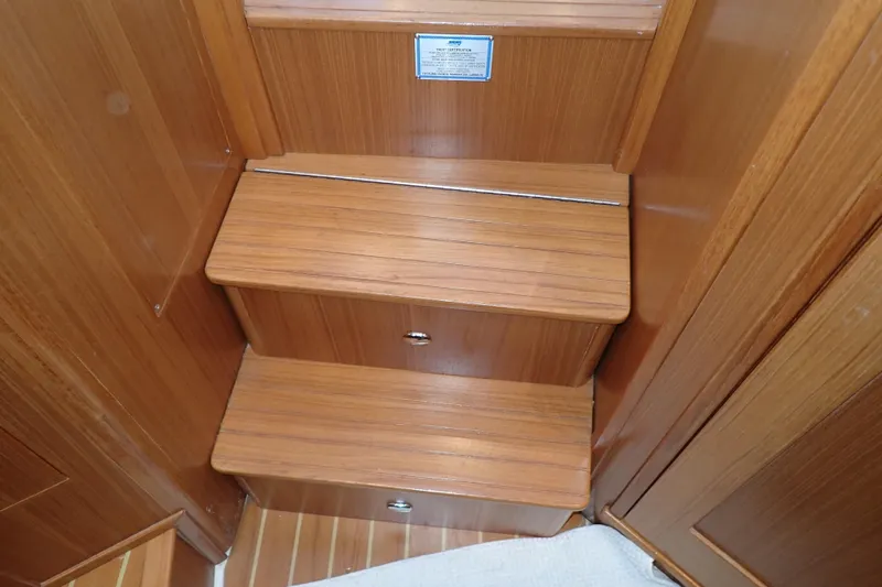 Slide: The Image of Wooden interior steps on 2023 True North 34 Outboard Express boat. - 69