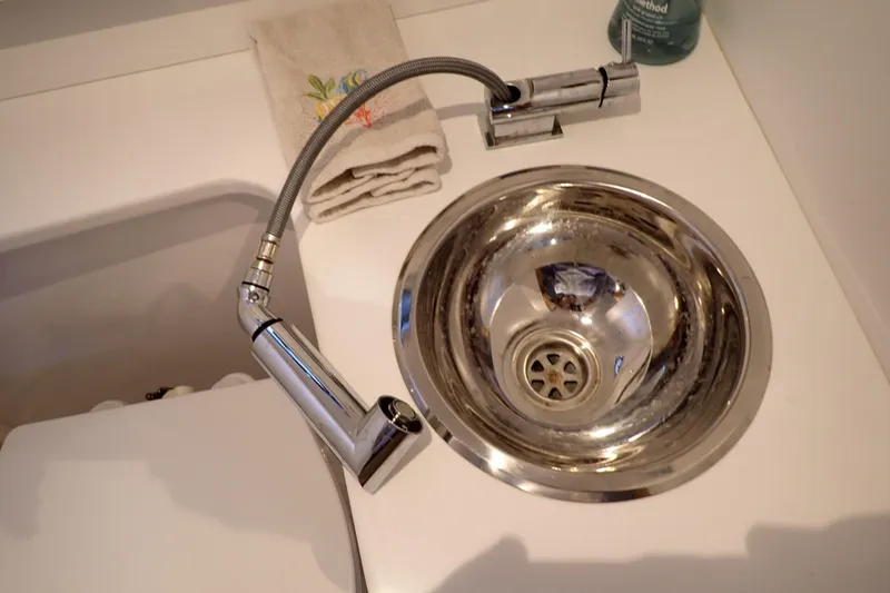 Slide: The Image of Stainless steel sink with flexible faucet in 2023 True North 34 Outboard Express boat. - 76