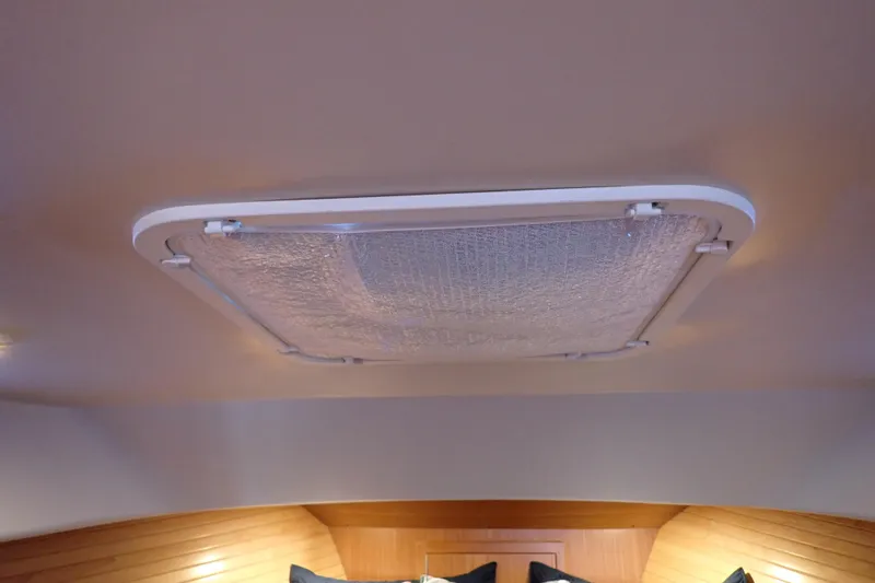 Slide: The Image of Ceiling hatch inside 2023 True North 34 Outboard Express boat cabin. - 83