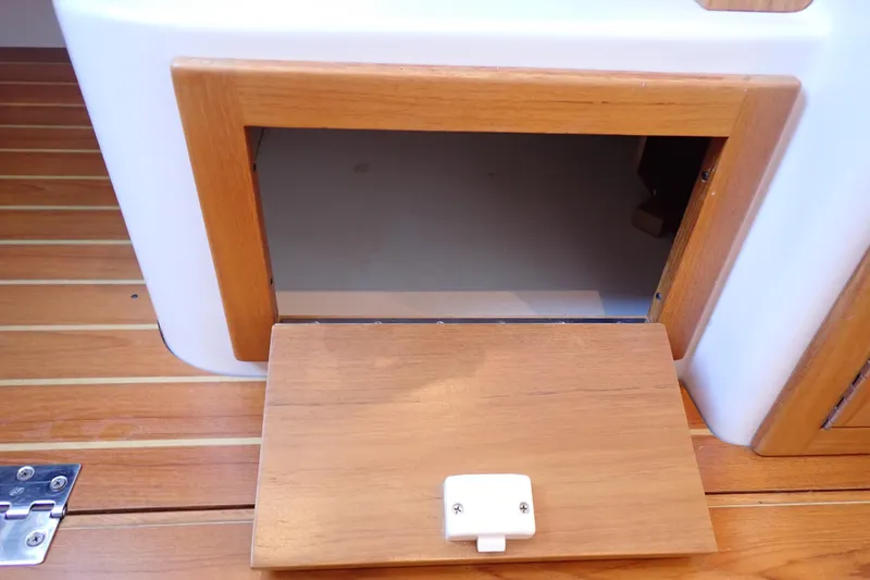 Slide: The Image of Wooden hatch on 2023 True North 34 Outboard Express boat deck. - 88