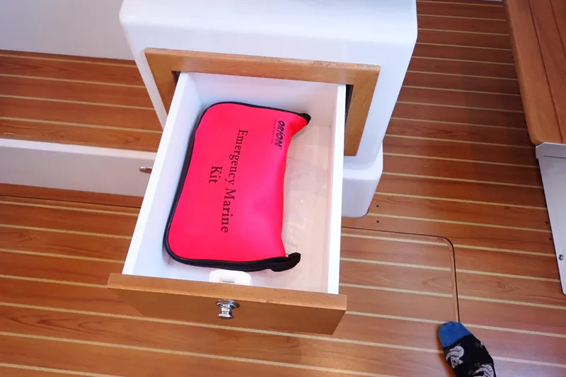 Slide: The Image of Open drawer on 2023 True North 34 Outboard Express with emergency marine kit inside. - 90