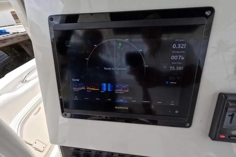 Slide: The Image of SmartCraft VesselView display on 2013 Boston Whaler 320 Outrage boat dashboard. - 17