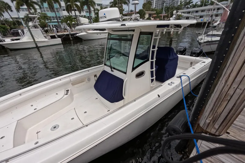 Slide: The Image of Garmin marine display on 2013 Boston Whaler 320 Outrage, showing navigation and system information. - 18