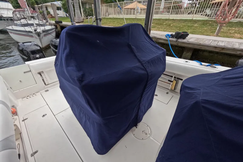 Slide: The Image of Garmin display on 2013 Boston Whaler 320 Outrage boat, showing sonar and navigation data. - 20