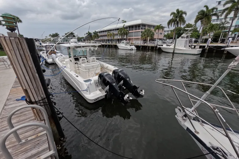 Slide: The Image of Storage compartment of a 2013 Boston Whaler 320 Outrage, containing various boating supplies. - 29