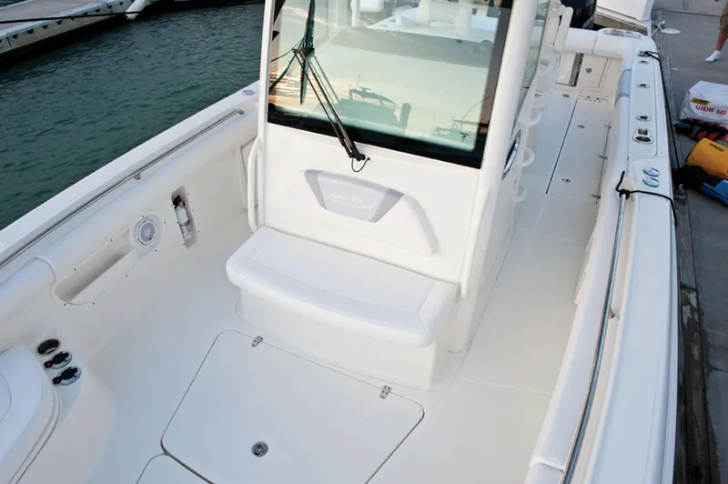 Slide: The Image of 2013 Boston Whaler 320 Outrage boat docked with dual Mercury engines. - 4