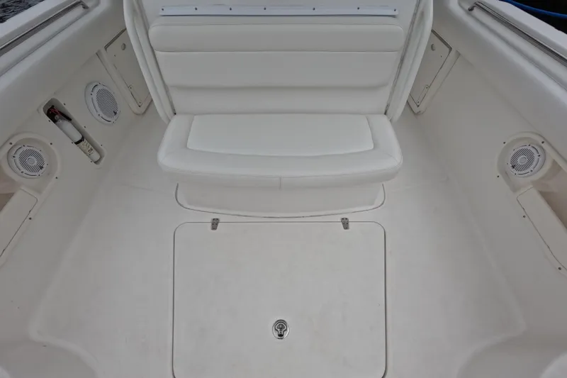 Slide: The Image of Boston Whaler 320 Outrage 2013 with Garmin radar, docked near palm trees and buildings. - 50