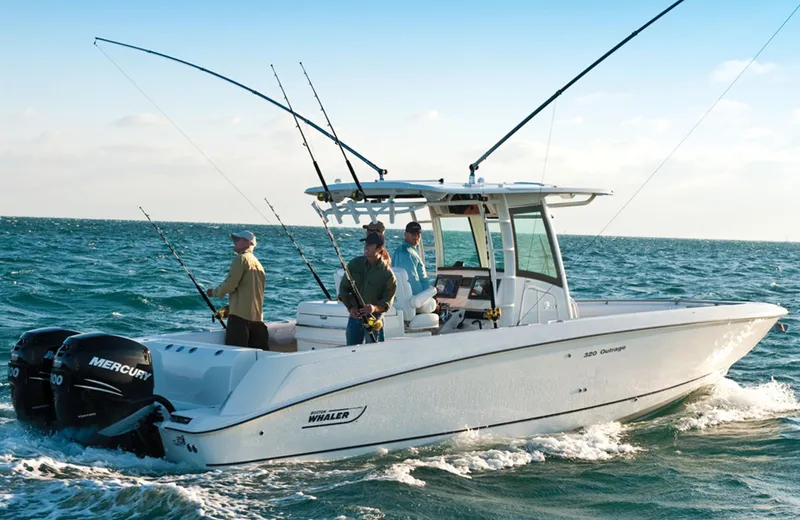 Slide: The Image of Manufacturer Provided Image: 2013 Boston Whaler 320 Outrage boat with anglers fishing in open water. - 57