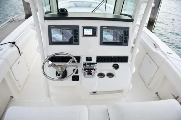 Slide: The Image of Manufacturer Provided Image: 2013 Boston Whaler 320 Outrage boat with dual 300 HP engines on the water. - 6
