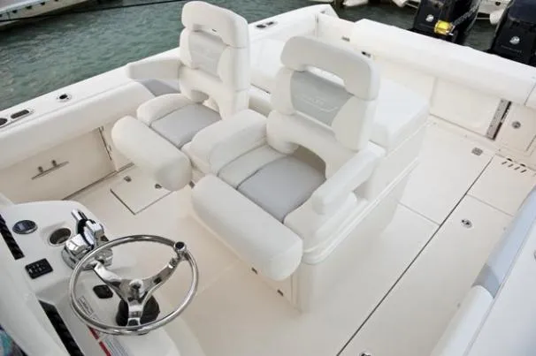 Slide: The Image of Manufacturer Provided Image: 2013 Boston Whaler 320 Outrage boat deck with seating and storage compartments. - 7