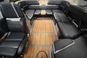 Slide: The Image of 2025 Supra SA interior with luxurious black seating and elegant wood flooring. - 10