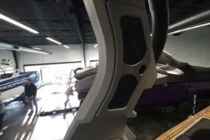 Slide: The Image of 2025 Supra SA boat in showroom, featuring sleek design and modern architecture. - 15