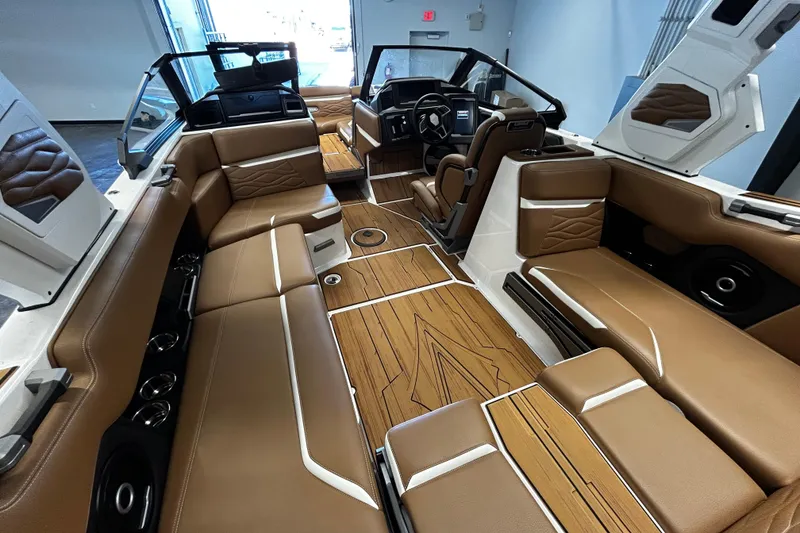 Slide: The Image of Luxurious interior of 2025 Supra SA boat with brown leather seating and modern design. - 6